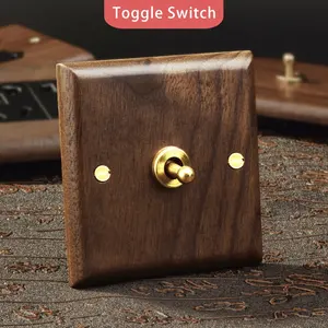 Sockets and switches electrical with Solid wood panel and Brass Toggle UK British standard 13A toggle rocker switch