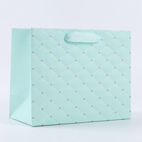 Sacs cadeaux en papier matelassé pastel imprimés offset avec poignées en ruban pour les faveurs de mariage et les projets d'artisanat