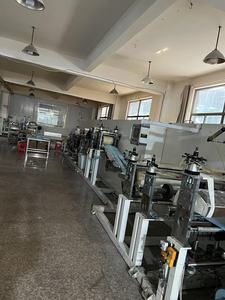 เครื่องผลิตผ้าอ้อมปรับขนาดได้ เครื่องผลิตผ้าอ้อมสำหรับผู้ใหญ่ เครื่องผลิตแผ่นรองนอนหลังคลอด เครื่องผลิตแผ่นรองดูแลผู้ป่วย สายการผลิตแผ่นรองซับ - Product Image 3