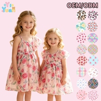 Robe d'été tendance personnalisable à bretelles spaghetti, volants et imprimé floral en mousseline, coupe trapèze fluide pour tenue décontractée familiale et jeunes filles