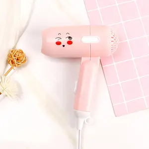 Mini secador de pelo portátil de plástico rosa con logotipo personalizado para niños, secador de pelo compacto plegable de doble voltaje para uso internacional