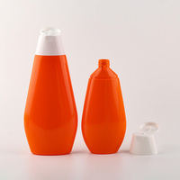 Emballage cosmétique pour soins de la peau, flacon en plastique HDPE de couleur orange de 200 ml et 400 ml avec bouchon à rabat pour lait corporel et crème