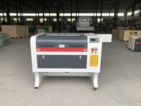 Mesin Pemotong dan Pengukir Laser CO2 China 80W Tipe Gantry PMI Berpendingin Air 6090 Mendukung DXF/DST untuk Dijual