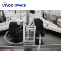 Machine de remplissage et de bouchage automatique de table Moonpack pour petites bouteilles d'huile essentielle, de lait et d'huile de cuisson