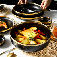 Service de table en céramique noir mat de luxe nordique, bols et assiettes à bord doré, vaisselle avec boîte cadeau pour mariage et maison