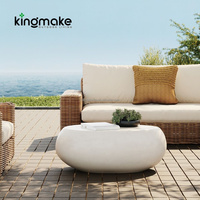 Table basse moderne en béton durable, forme pierre, pour balcon et terrasse d'hôtel, idéale pour un usage quotidien