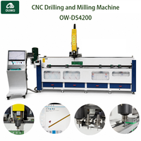 Machine de perçage et de fraisage CNC en aluminium OUWO 4200MM pour fenêtres et portes avec magazine d'outils pour usine de murs-rideaux