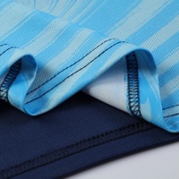 Ensemble d'uniformes de football personnalisés en polyester à motif marbré cyan marine, imprimés par transfert thermique, séchage rapide, vente en gros