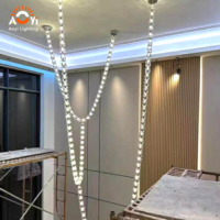 Lustre cascade personnalisé en grandes perles de cristal, suspension moderne en cristal pour escalier, hall d'hôtel, villa de luxe