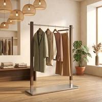 Étagère de présentation en acier inoxydable peinte couleur noyer personnalisée avec base en acier inoxydable anti-corrosion pour les magasins de vêtements