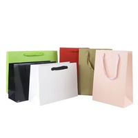 Sac de luxe pour la vente de vêtements au détail Emballage Sac cadeau rose Bolsas De Papel Emballage à provisions Sacs en papier avec poignées