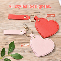 Miroir de maquillage lumineux en forme de cœur, rotatif, en cuir PU, petit, compact, pliable, portable, avec porte-clés
