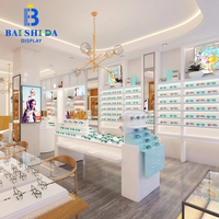 Aménagement de magasin d'optique minimaliste sur mesure, ensemble complet de présentoirs muraux blancs pour lunettes et présentoirs îlots pour vitrine d'opticien