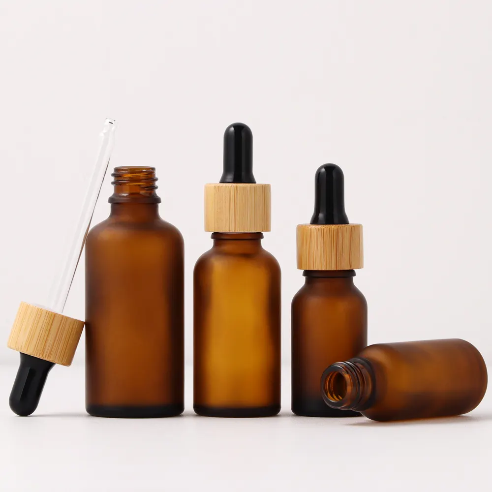Bottiglia di olio essenziale di pipetta cosmetica smerigliata ambra siero per la cura della pelle bottiglia di vetro 15ml 20ml 30ml 50ml con contagocce di bambù