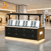 Exhibidor de Gafas de Doble Cara con Acabado en Madera y Cajón de Almacenamiento