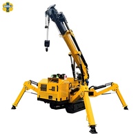 Mini-grue hydraulique sur chenilles de type araignée avec flèche télescopique pour l'installation de murs-rideaux en verre et structures en acier