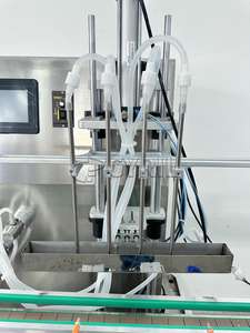 "Remplisseur de liquide à pompe magnétique automatique à 4 têtes: rapide comme l'éclair, super précis! Idéal pour la boisson, Pharma. Maximisez vos profits maintenant!" - Product Image 2