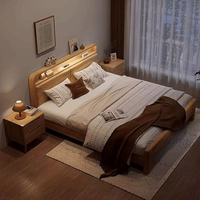 Cadre de lit king size en bois massif moderne sculpté à la main personnalisable avec un grand rangement et une lumière USB multifonctionnelle