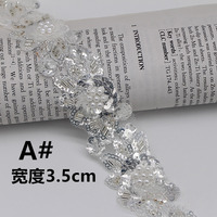 Vente en gros de dentelle brodée chimique, garniture en dentelle, maille brodée en polyester, dentelle à sequins argentés pour robe