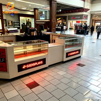 Vitrine en verre incurvée éclairée avec rangement pour kiosques de coques de téléphone, destinée aux centres commerciaux et aux boutiques numériques en îlot