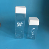 Bouteille à boisson carrée transparente en plastique PET de haute qualité avec surface givrée, avec bouchon et brosse pour jus et boissons