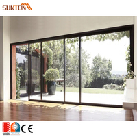 Ensemble de portes coulissantes doubles en aluminium noir avec moustiquaire pour balcon et patio extérieur de villa moderne