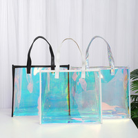 En gros personnalisé coloré laser holographique mode clair transparent imperméable PVC fourre-tout cadeau femmes sac à provisions poignées