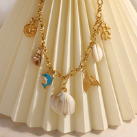 Collier avec pendentif dauphin en corail |   Collier ras du cou pour femme en acier inoxydable plaqué or 18 carats PVD, étanche, style plage océanique, vente en gros