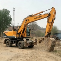 Excavatrice sur pneus Hyundai 210 d'occasion, modèle 2024, très populaire et très demandée, avec moteur Cummins, pompe hydraulique Kawasaki, moteur, engrenage et contrôle PLC