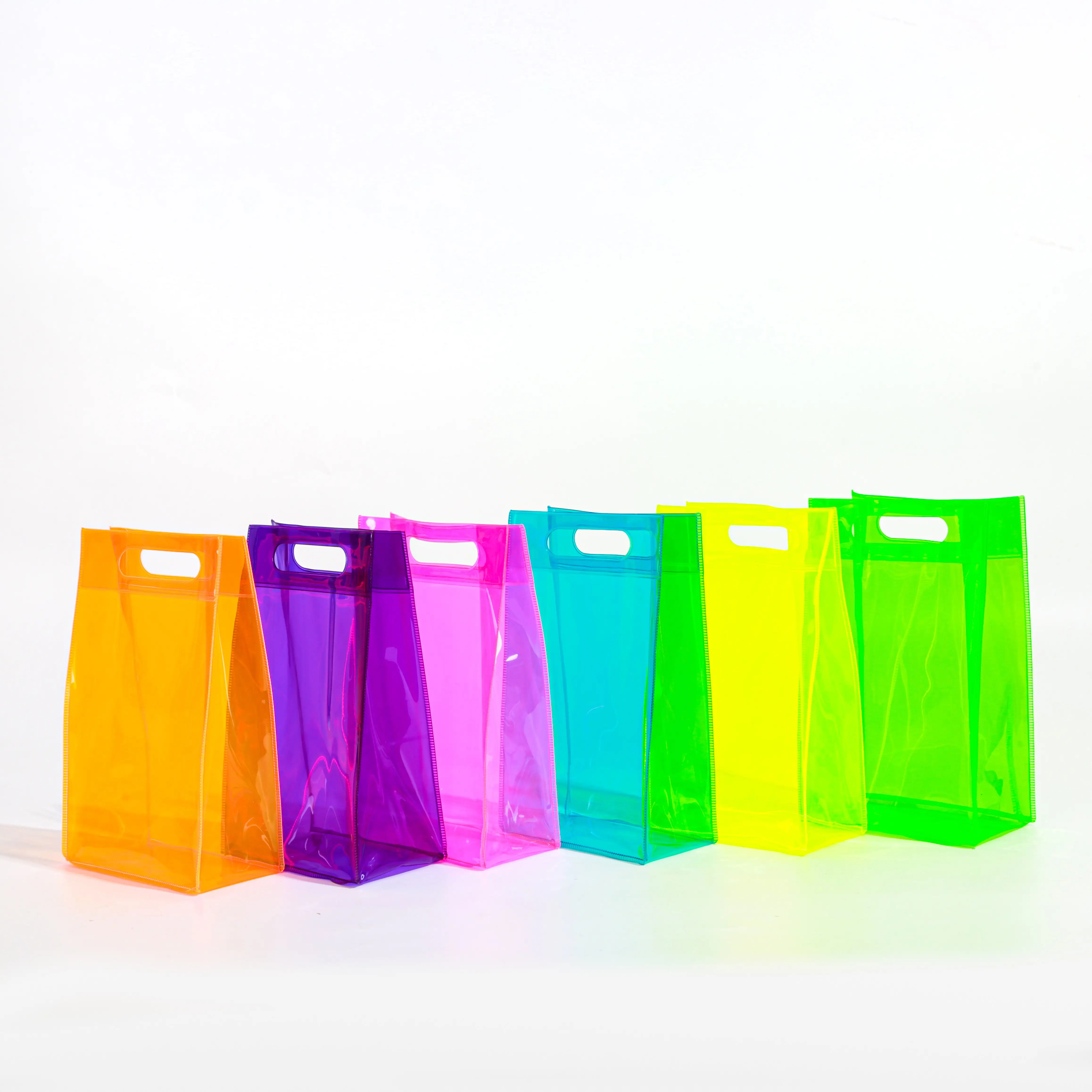 Basso MOQ personalizzato in PVC colorato dolci caramelle accessori per capelli borsa EVA trasparente trucco da viaggio borsa da toilette con manico