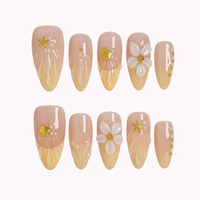Faux ongles à presser dégradé rose nude et jaune, forme amande moyenne, en acrylique, avec motifs 3D coquillage doré, étoile de mer, fleur et perle