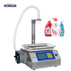 Machine de remplissage semi-automatique de liquides à emplacement compact, conception à tête unique pour l'emballage de boissons et de produits chimiques - Product Image 1