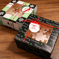 Boîte à gâteau en carton blanc festif et coloré, motif bonhomme de neige de Noël avec fenêtre découpée, pour présentation de pâtisserie de comptoir de fêtes