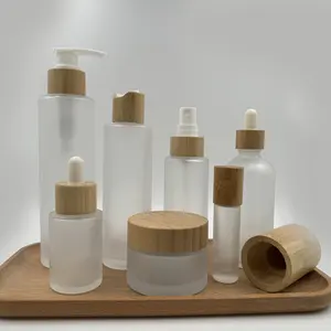 Cosmetic Packaging Set 50ml 100ml 120ml 150ml 4oz Frosted Glass Pump Bottle 1oz 2oz Serum Oil Bottles With Bamboo Lid