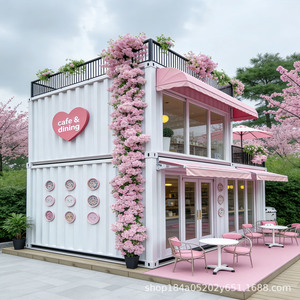 Café-restaurant moderne en conteneur avec fleurs roses et auvent, espace repas extérieur, design rectangulaire. - Product Image 1
