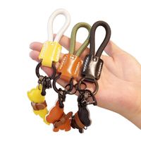 Nouvel arrivage Porte-clés de luxe pour chiot Pendentif lanière anti-perte avec corde tissée Porte-clés voiture de combat pour chien en cuir de qualité supérieure