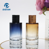 Flacon de parfum en verre cylindrique rond de luxe personnalisé avec impression couleur 30 ml 50 ml 100 ml avec pompe pulvérisateur et boîte