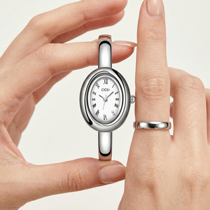 Vintage Oval Gold <b>Bangle</b> Watch for Women with Roman Numerals Diamond Set Dial Integrated Quartz Watch - Product Image 3