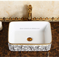 Lavabo à poser en céramique plaqué or pour salle de bain