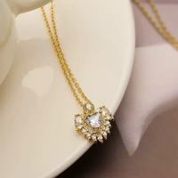 LUOYUNE Collier Pendentif Vintage en Laiton Plaqué Or 18K, Forme Cœur, Breloque Zircon Bleu, Bijou Idéal pour Cadeau, Vente en Gros ODM