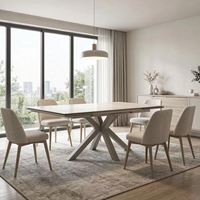 Table à manger extensible élégante finition beige avec pieds croisés en métal élégants pour la salle à manger