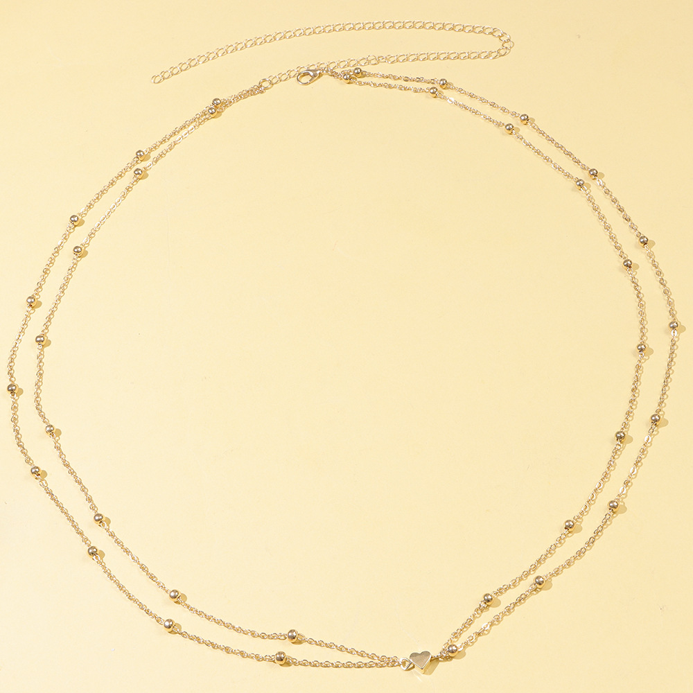 Cadena de cintura de doble capa con corazón dorado