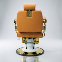 Fauteuil de barbier de luxe avec cadre plaqué or, revêtement en cuir PU orange-brun, appui-tête réglable, inclinable, équipement de salon de coiffure