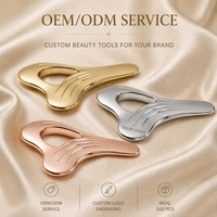 Outil de massage Gua Sha en alliage de zinc en forme de cœur creux pour soulager les muscles et les douleurs corporelles