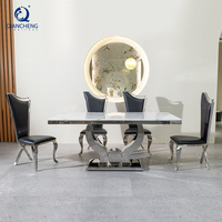 Ensemble de table à manger en marbre et acier inoxydable pour la salle à manger des maisons, avec 6 chaises