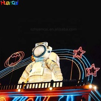 Modèle géant gonflable d'astronaute pour scène de carnaval, énorme astronaute gonflable couché sur la Lune, personnalisé avec éclairage