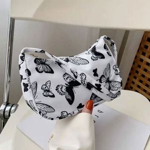 Wholesale Butterfly <b>Candy</b> Pattern Button Closure Single Strap PU Handbags Fashion Women Shoulder Bags 6 Inch Polyester Lining - Product Image 6