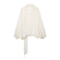 Nouvelle Collection Automne Hiver 2026 – Blouse Ample Femme Blanche Ivoire avec Nœud Papillon, Manches Ballon et Poignets Froncés – Transparente et Élégante pour Soirée – Vente en Gros