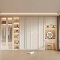 Système de dressing moderne sur mesure en mélamine avec éclairage LED, coiffeuse et portes à fermeture amortie pour chambre à coucher