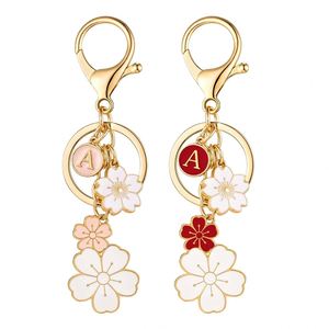 Llavero de flor esmaltada rosa con inicial, mosquetón de aleación de zinc con diseño de dibujos animados, colgante para mochila, bolso, llavero, regalo - Product Image 1